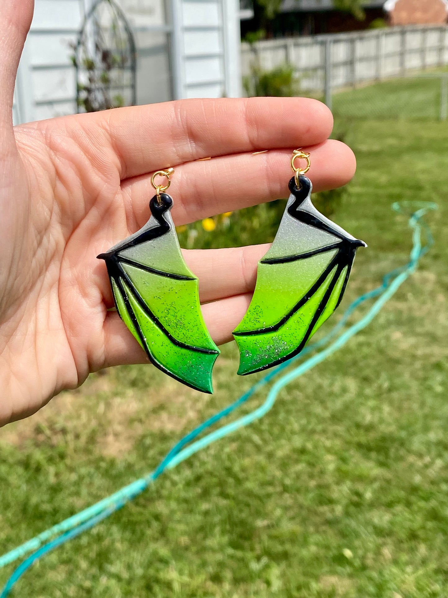 Enchanted Flight – Silver & Green Bat Wing Dangle Earrings