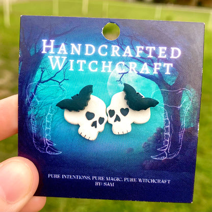 Nocturne Remains – Bat-Topped Skull Stud Earrings