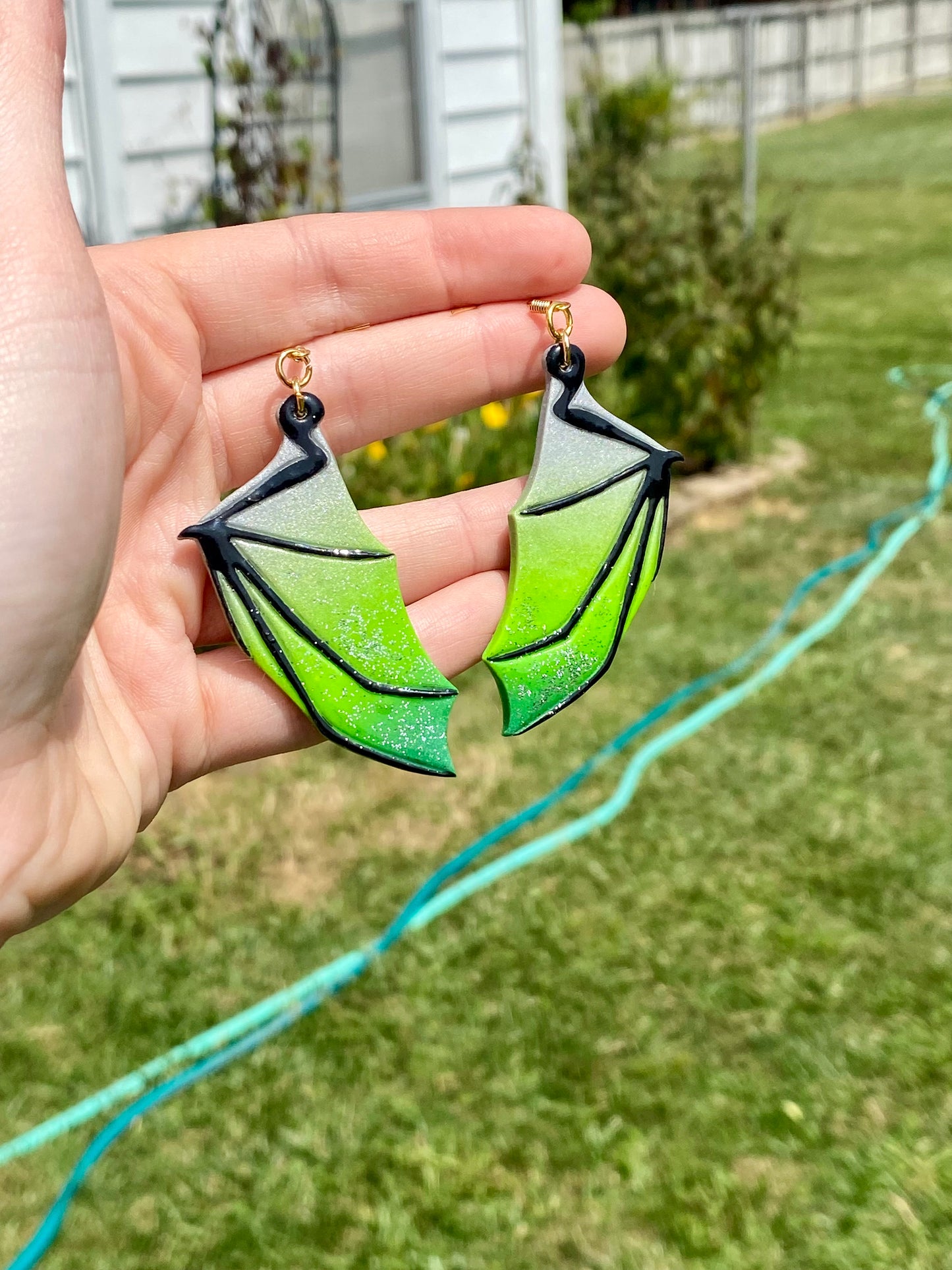 Enchanted Flight – Silver & Green Bat Wing Dangle Earrings